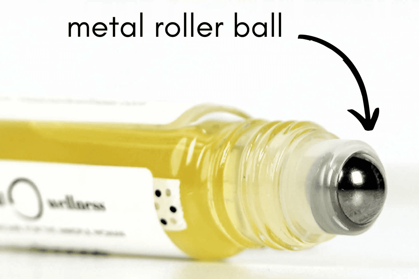 Close up view of a metal roller on a 10mL roller bottle